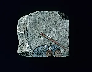 Relief with two heads and a stick