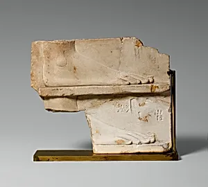 Sculptor's model / votive relief with two sides: side one, two registers with a right foot on each; side two, a royal-like figure
