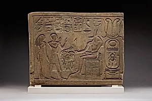 Stela of Siamun and Taruy worshipping Anubis