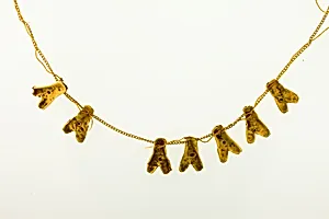 String of 7 fly amulets