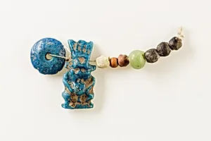 String of Beads and Bes Amulet
