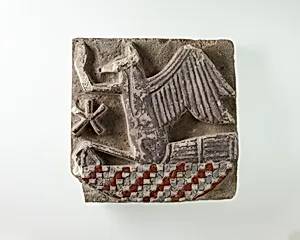 Tile in the form of a rekhyt bird surmounting a neb sign