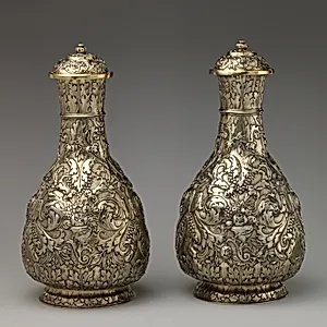 Bottle with cover (one of a pair)