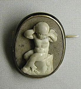 Cupid chained to a rock