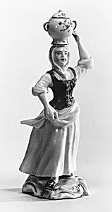 Female figure carrying a vessel