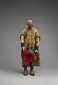 King in gold beaded coat, yellow vest, red pants with silver chest by Unknown Artist