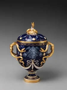 Lidded vase with Medusa decoration and snake handles
