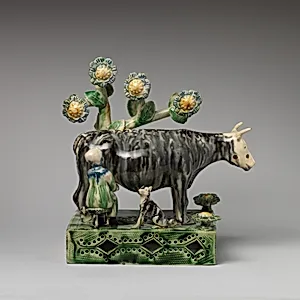 Milkmaid and cow with a dog