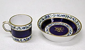 Miniature cup and saucer by Sèvres Manufactory