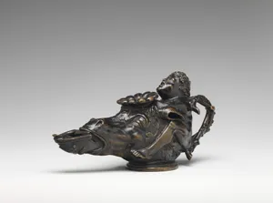Oil lamp in the form of a dwarf on a donkey’s head