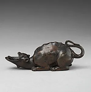 Oil lamp in the form of a grotesque animal