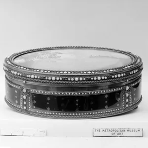 Snuffbox with scene of peasants picnicking on a riverbank near a village