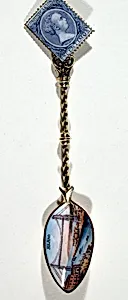 Souvenir spoon with view of Bilbao harbor and tower bridge and finial in form of a postage stamp