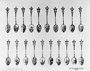 Souvenir spoon with view of hillside-built town and arms of Savoy