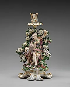 Venus and Cupid candlestick (one of a pair)