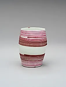White beaker decorated with red lines