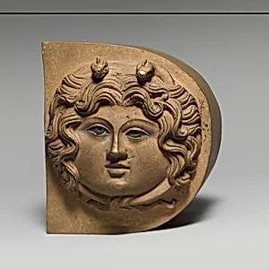 Bronze finial with the head of Medusa