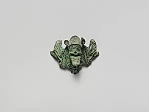 Bronze helmet attachment by Unknown Artist