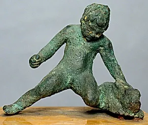 Bronze statuette of a kneeling boy holding a hare