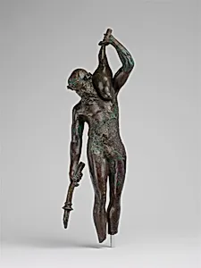 Bronze statuette of a satyr with a torch and wineskin