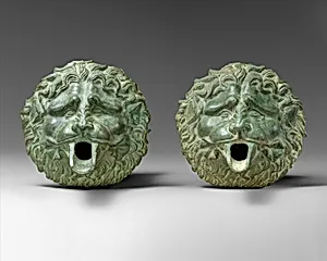 Bronze water spout in the form of a lion mask (one of a pair)