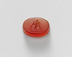 Carnelian intaglio of a gladiator fighting a lion