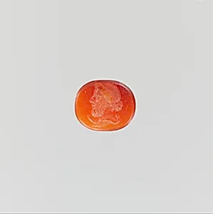 Carnelian ring stone with Asclepius, the god of medicine
