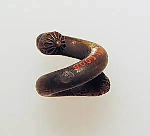 Earring, spiral with lion's head