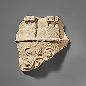 Fragment of a limestone crown belonging to a statue of the Great Goddess