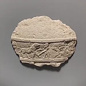 Fragment of a limestone statue of a male votary (worshipper)
