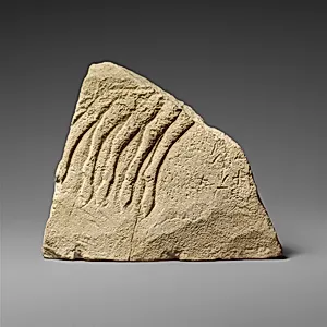 Fragment of a limestone votive relief with a quadriga (?)