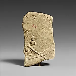 Fragment of a limestone votive relief with a boat