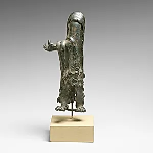 Fragmentary bronze statuette of Herakles with lion's skin