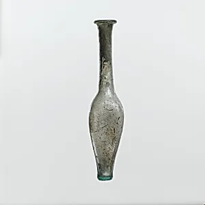 Glass bottle with indented side
