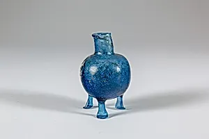 Glass bottle with three feet