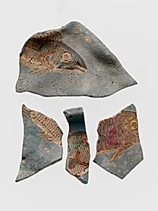 Glass fragments of bowl decorated with mosaic fish