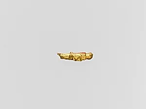 Gold capsule in the form of a grasshopper