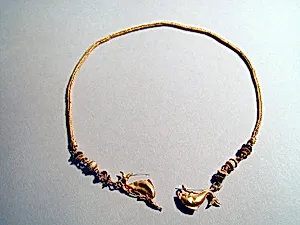 Gold chain with dolphins and glass beads