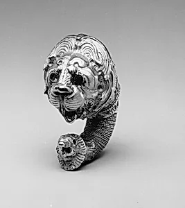 Gold double lion's head earring