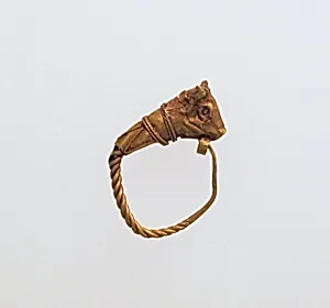 Gold earring with head of a bull