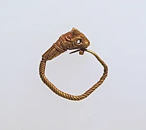 Gold earring with head of a bull