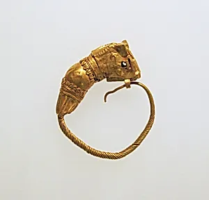 Gold earring with head of a bull
