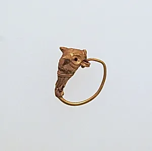 Gold earring with head of a bull