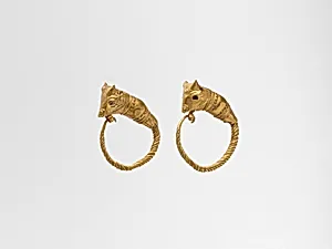 Gold earring with head of a bull