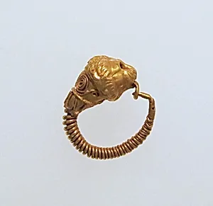 Gold earring with head of a lion