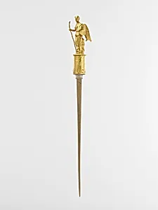 Gold head of a pin with the figure of Nike (Victory)