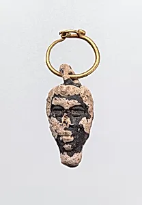 Gold hoop with glass pendant in the form of a youthful head