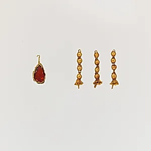 Gold pendant with garnet and three gold tassels