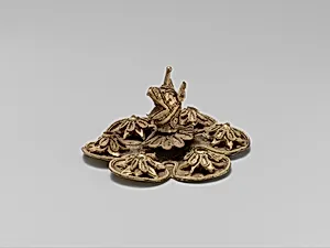 Gold rosette with the head of a griffin