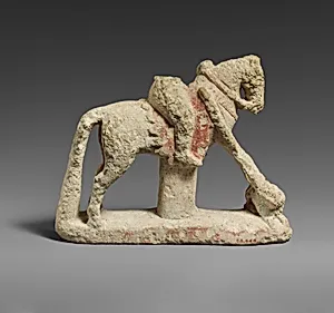 Limestone horse with a rider hunting a lion
